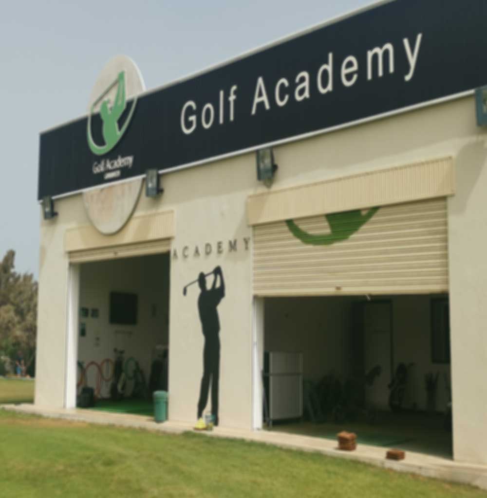 Golf player in sportswear with a ball